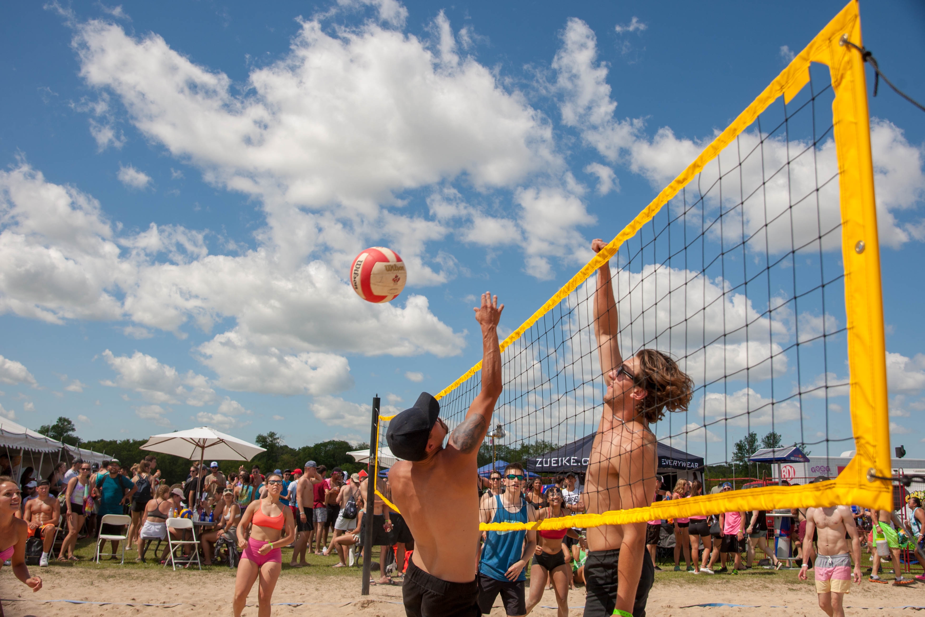 Two volleyball players at the net